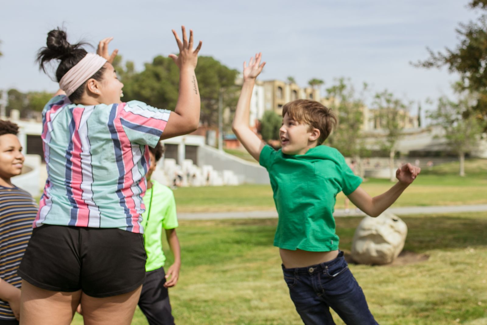 Teacher and students celebrating together